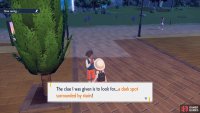 Gisela will tell you to look for a dark spot near some stairs.