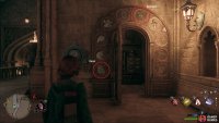 Enter the first symbol in the block to the left of the puzzle door, and the second on the one downstairs.