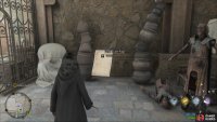 The statue will disappear when you cast Levioso and you’ll be able to loot the page.