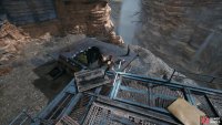 Take it to the edge of the platform, and throw it through the hole to break the wall.