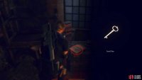 You’ll find the Key on the wooden crate, left of the doorway.