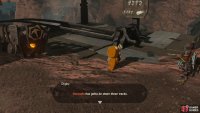 Follow him to the mine cart track above the Goron City Gate.