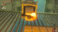 You need to throw the lit Torch at the object hanging down from the pillar.