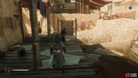 You are looking for an NPC near a rug on the river dock.