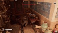 Go inside after killing those two guards to find the key on a table.