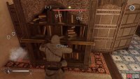 You’ll have to move two shelves to reach the chest.