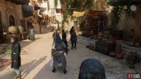 You will see two men chatting; one of them has the artifact.