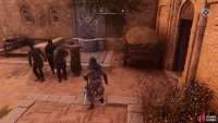 You will find the artifact in a small courtyard. The NPC is in a group of men.