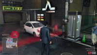 He will be standing right next to the telephone booth, in front of the parking lot.