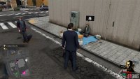 The guy will be sitting on the ground, right by the street corner.
