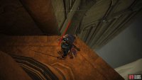 Drop to the ledge directly underneath and then jump onto the narrow ledge a bit further below.