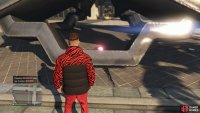 to find the action figure sitting in the arrow sculpture.