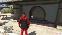to find this action figure sitting by a wall.