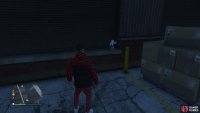 to find the action figure sitting next to a loading dock.