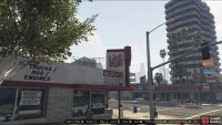to find the monkey mosaic sitting on the Woody’s Autos sign.
