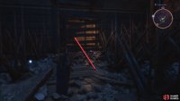 Drop in between the spikes near the Beacon, and smash the wooden boards.