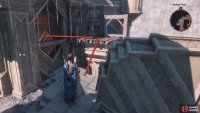 Climb the debris to the north, and use it to jump over to the scaffolding and into the building.