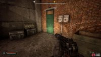 Head to the end of the warehouse and go through the green door.
