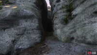 follow the cliffs beyond the boulder to find a cleft,