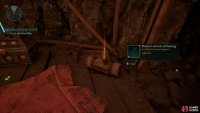 The fragment lies next to a chest.