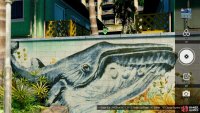 Right next to the stand is a mural of a whale on the wall.