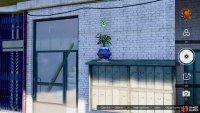 There will be some mailboxes next to the building, but the target is the blue planter on top of them.