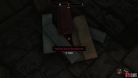 Find a trap door buried under some cloth,