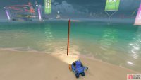 From the starting flag, go west. Drive across the water to the right of the yellow plane to find another track.