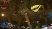 Grapple up to the broken walkway, then hop across to the other side.