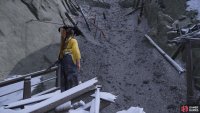 At the end of another broken bridge, turn left and jump and grapple over to reach a rope up a slope.